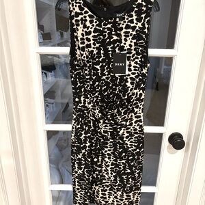 DKNY animal print dress Never worn , tags on . Size 4